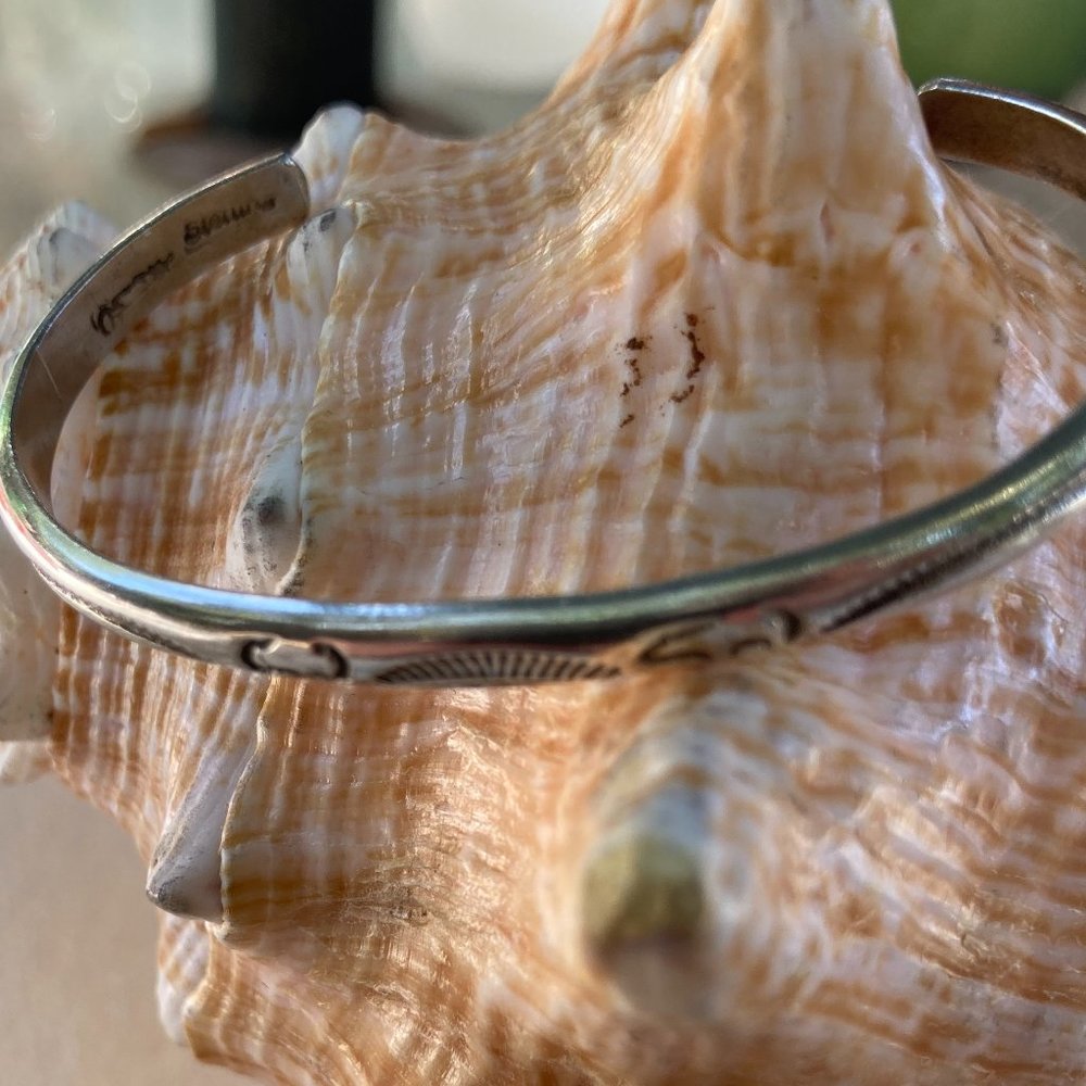 Vintage child-sized sterling silver bear and buffalo cuff bracelet